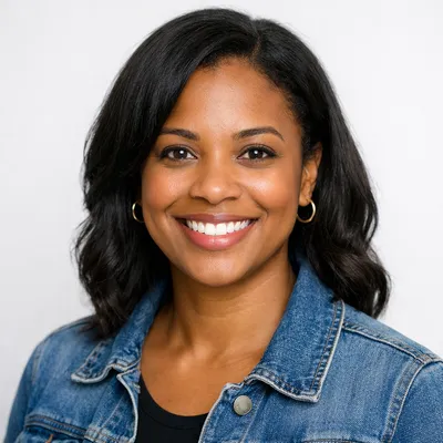 Photorealistic avatar of a diverse adult with a warm smile, wearing casual attire against a light background.